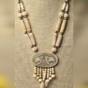 Vtg Hand Carved Bone Necklace w/ A Double Elephant Trunks Raised Pendant
